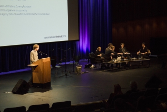 Picture of Kristoffer Gansing (left) introducing the panel "An Ecosystem of Excess"