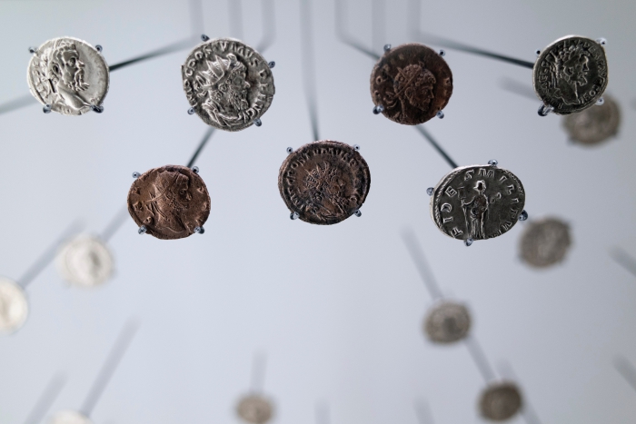 Roman coins. Photo by Nikita Andreev on Unsplash