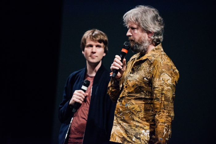 Picture of Kristoffer Gansing (left) and Remco Schuurbies introducing the performance/installation "Still Be Here"