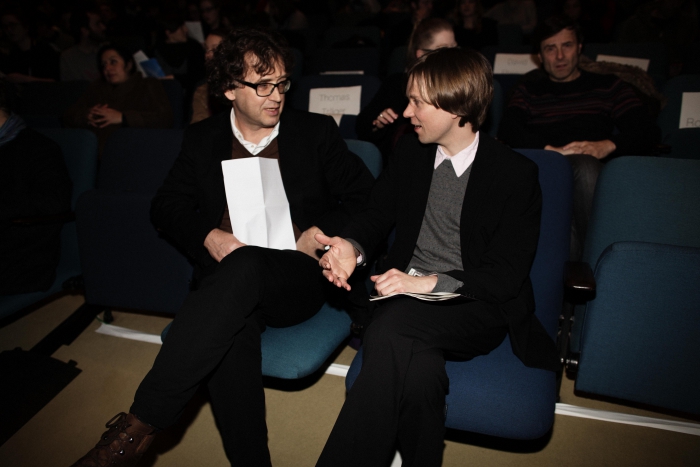 Picture of Bernd Scherer (left) and Kristoffer Gansing (right) talking before "afterglow effects: transmediale 2014 opening ceremony"