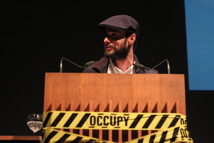 Krystian Woznicki introducing the keynote "The Incompatible Public is Occupied", transmediale 2012 in/compatible.
