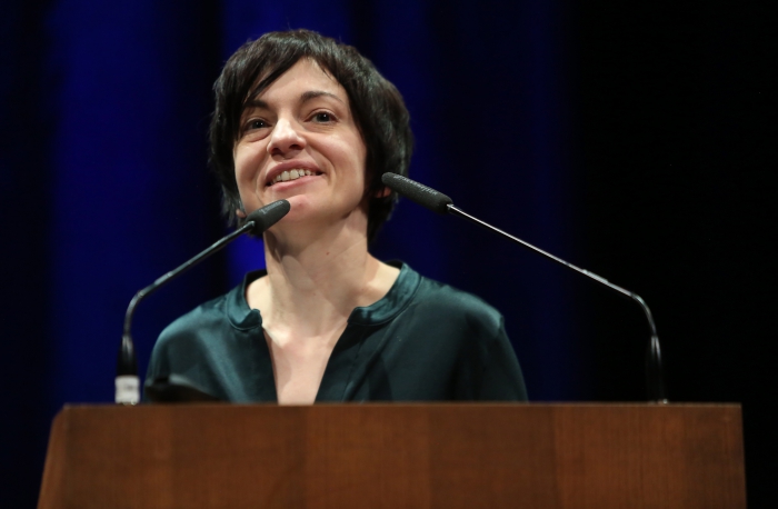Daphne Dragona introducing the keynote "Derivative Living", transmediale 2018 face value.