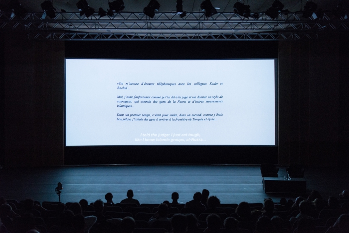Impression of the screening "Also Known As Jihadi" at transmediale 2018 face value.