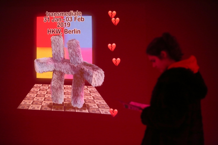 Visitor with transmediale 2019 visual 